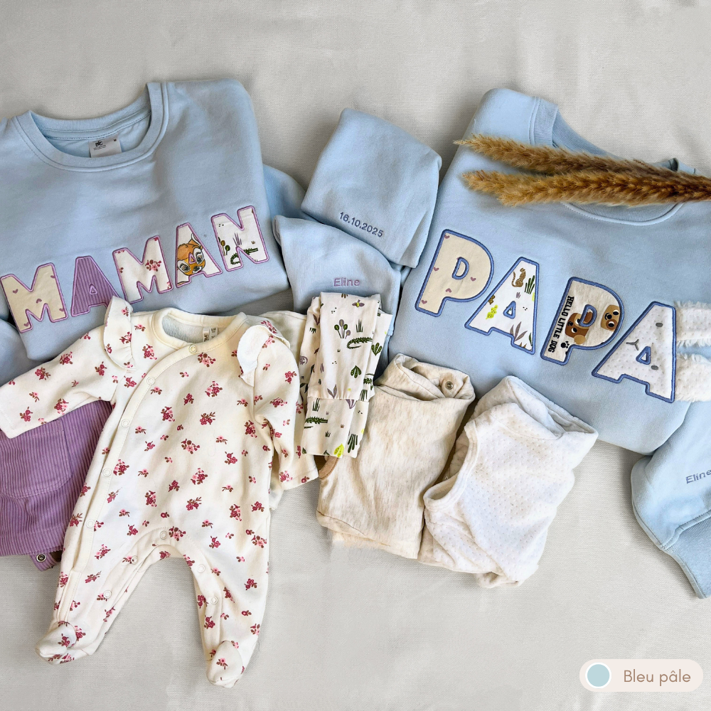 Duo sweat souvenir personnalisé homme et femme col rond bleu pâle, brodé « MAMAN » et « PAPA », prénom Eline brodé sur les manches, appliqués animaux